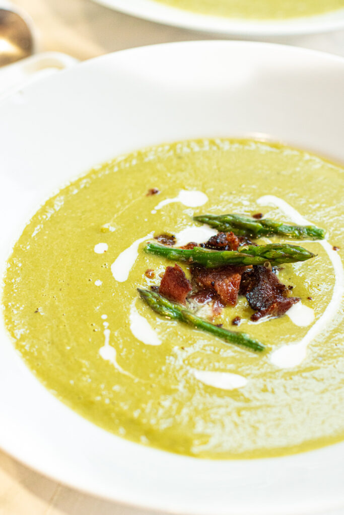 bowl of soup with bacon and asparagus and cream