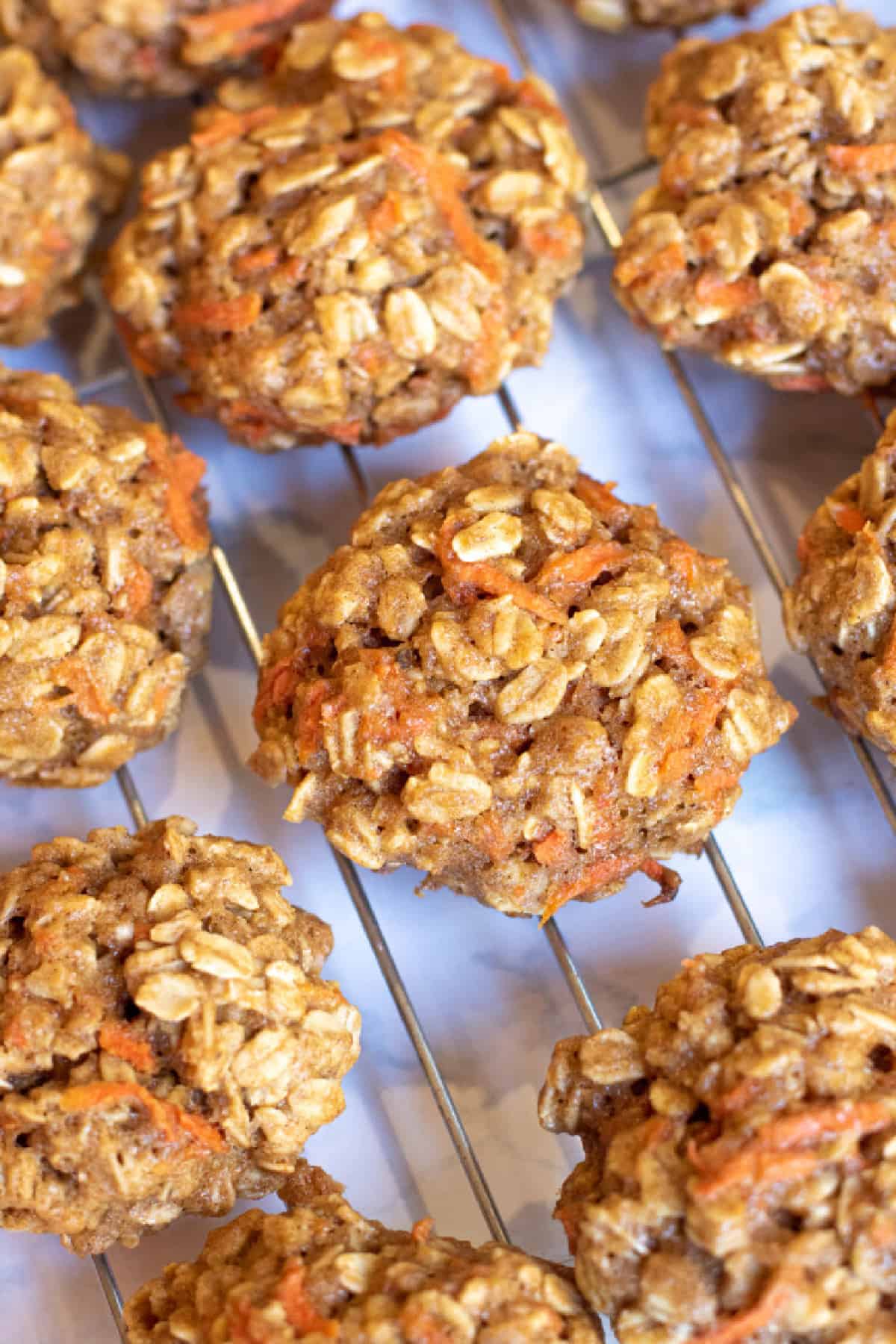 a cooling rack of oatmeal carrot cookies.