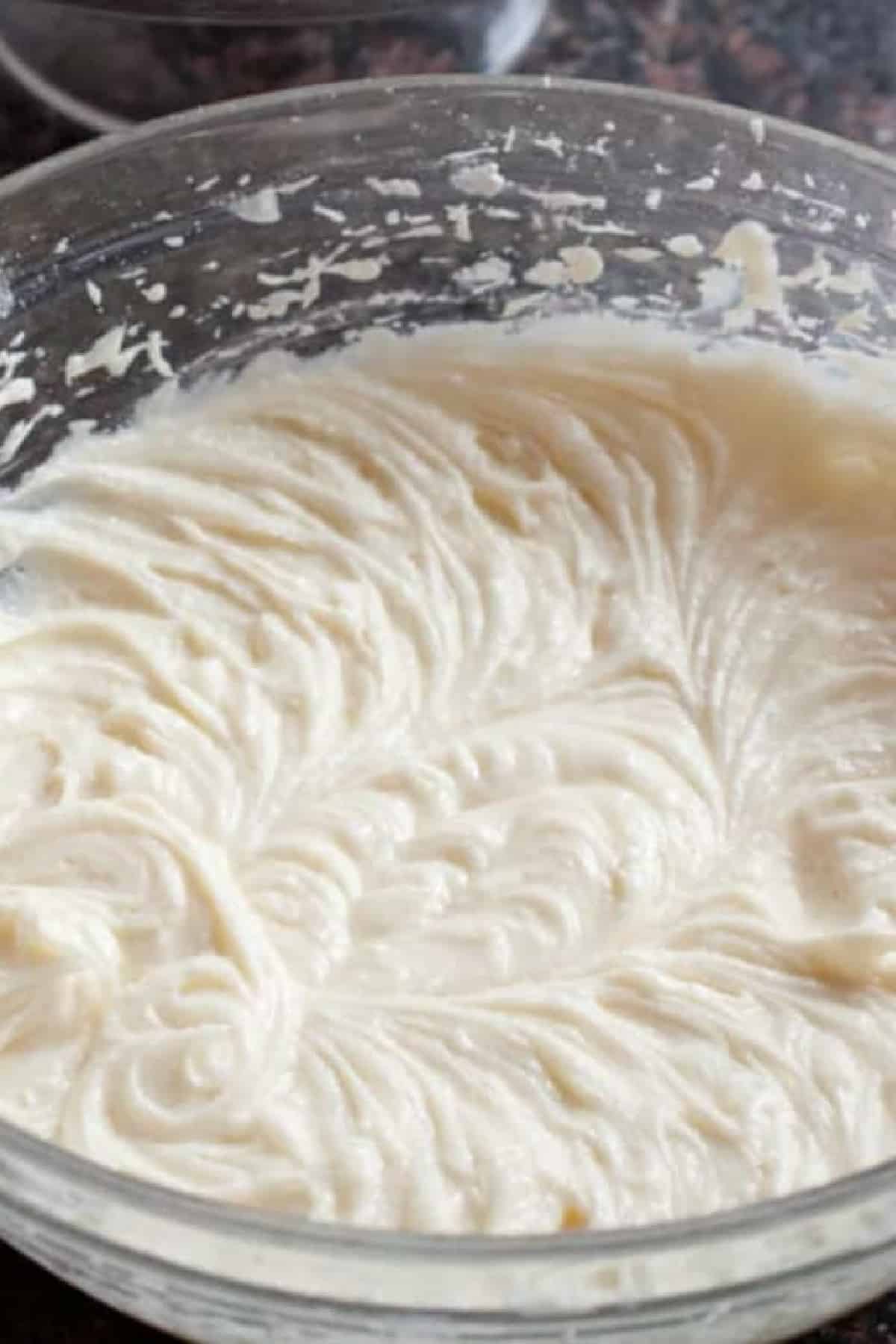 a bowl of cream cheese frosting.