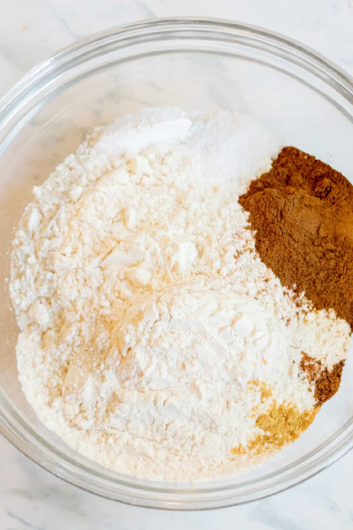 a bowl of flours and cinnamon and spices.