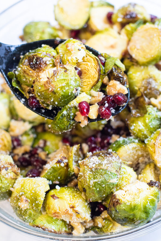 a bowl of brussels sprouts salad with cheese.
