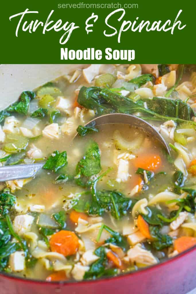 a pot of veggie noodle soup with spinach with ladle with Pinterest pin text.