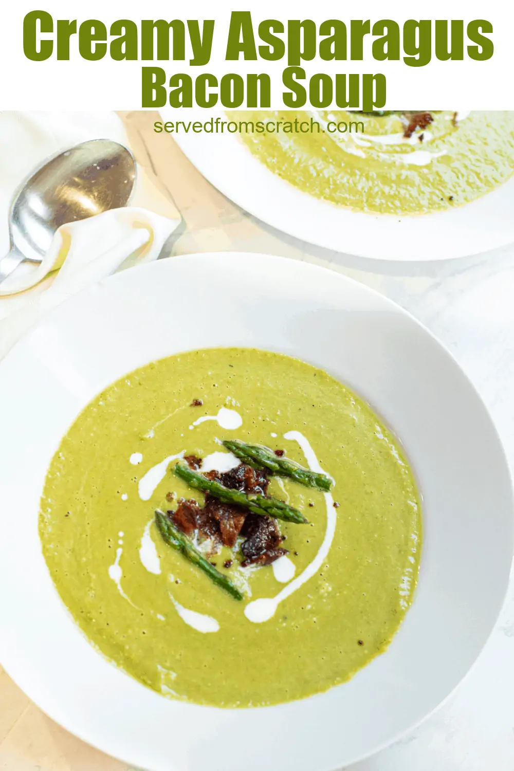 a close up of a bowl of creamy green soup with asparagus and bacon on top.