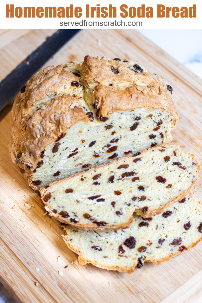 baked bread with raisins sliced on cutting board and pinterest text.