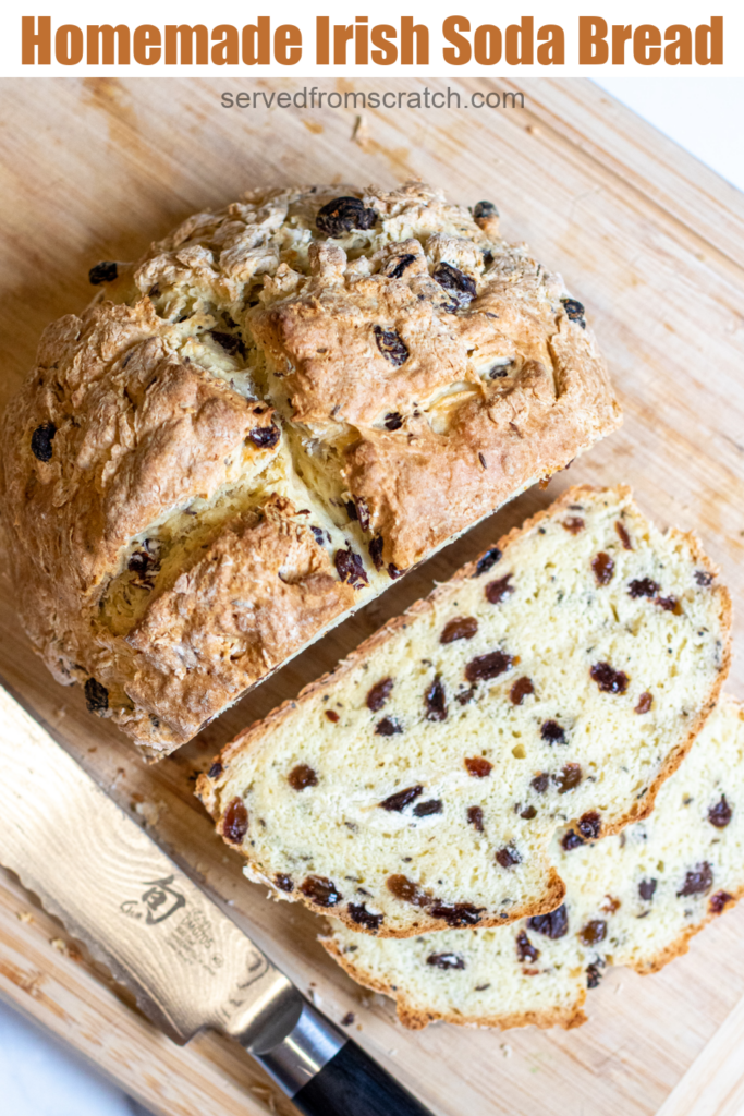 baked bread with raisins sliced on cutting board and pinterest text.