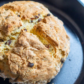 baked bred with raisins in a cast iron skillet.