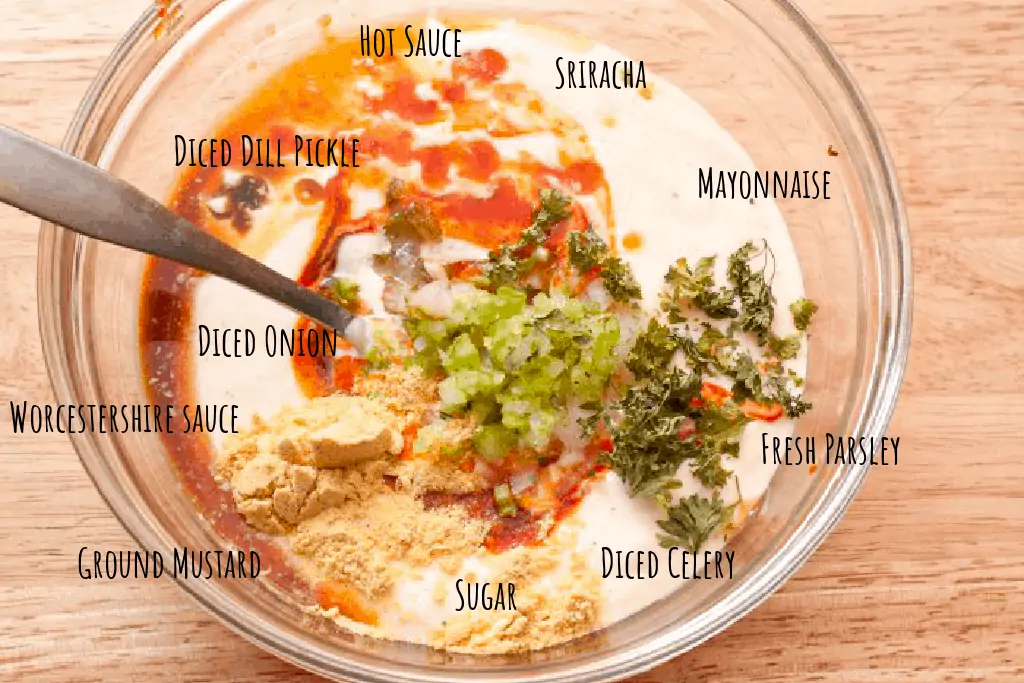 a bowl of mayo, hot sauce, celery, onion, parsley, mustard powder, sugar, 