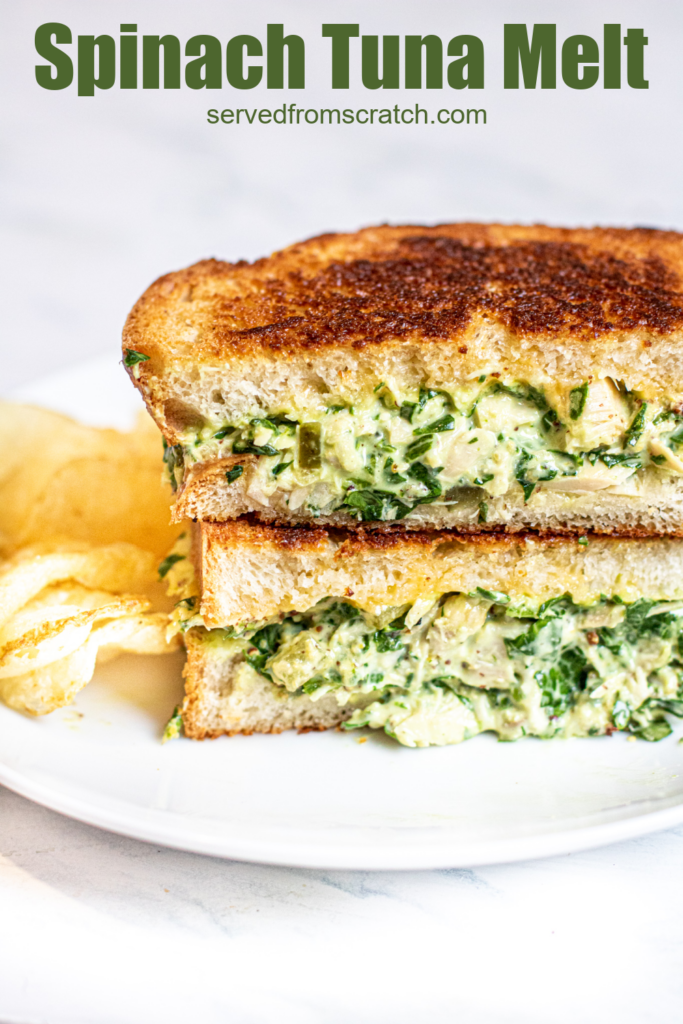 stacked tuna melt with spinach on a plate with chips with Pinterest pin text.