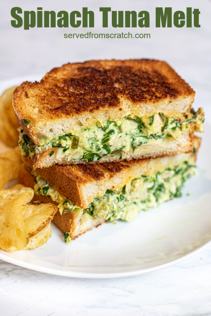 stacked tuna melt with spinach on a plate with chips with Pinterest pin text.