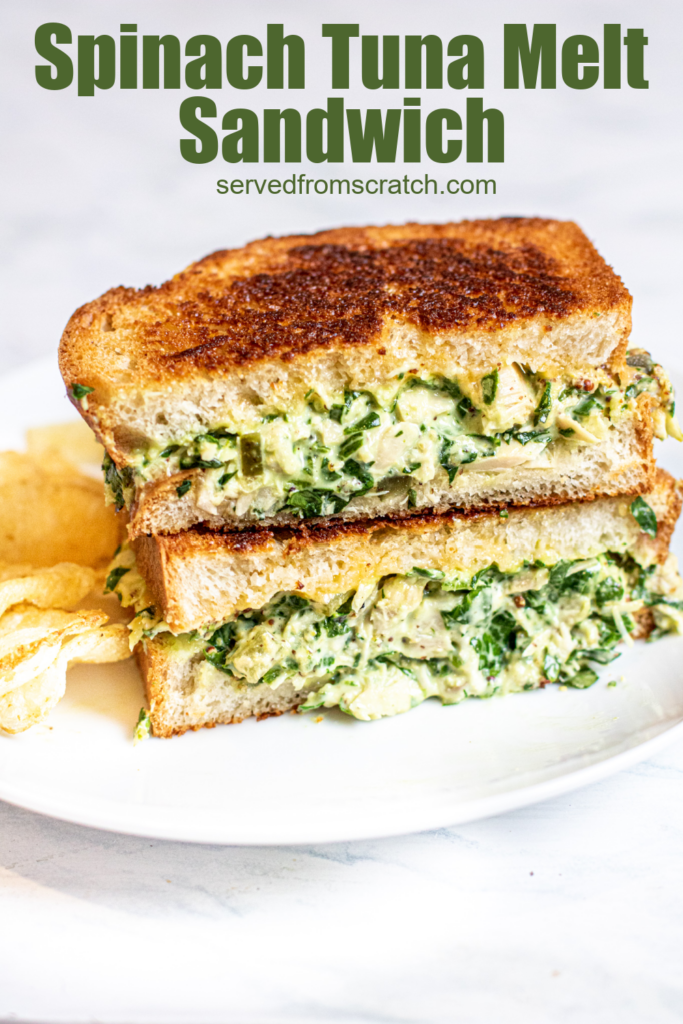 stacked tuna melt with spinach on a plate with chips with Pinterest pin text.