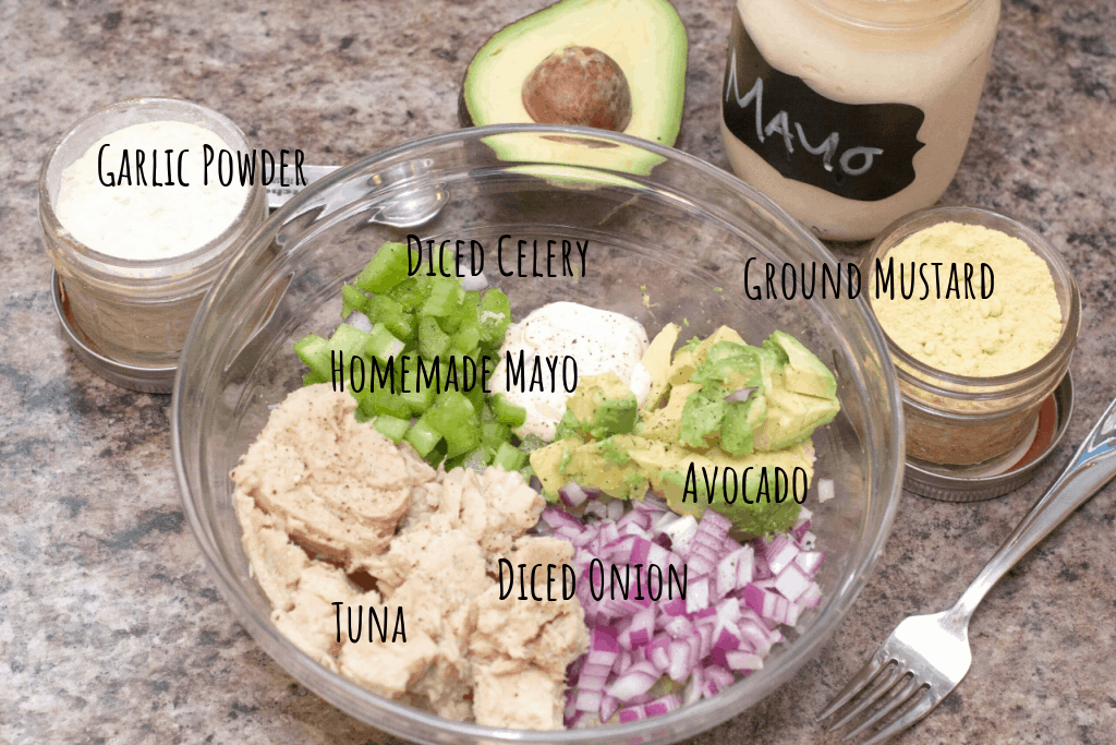 a bowl of mayo, tuna, onion, avocado, celery