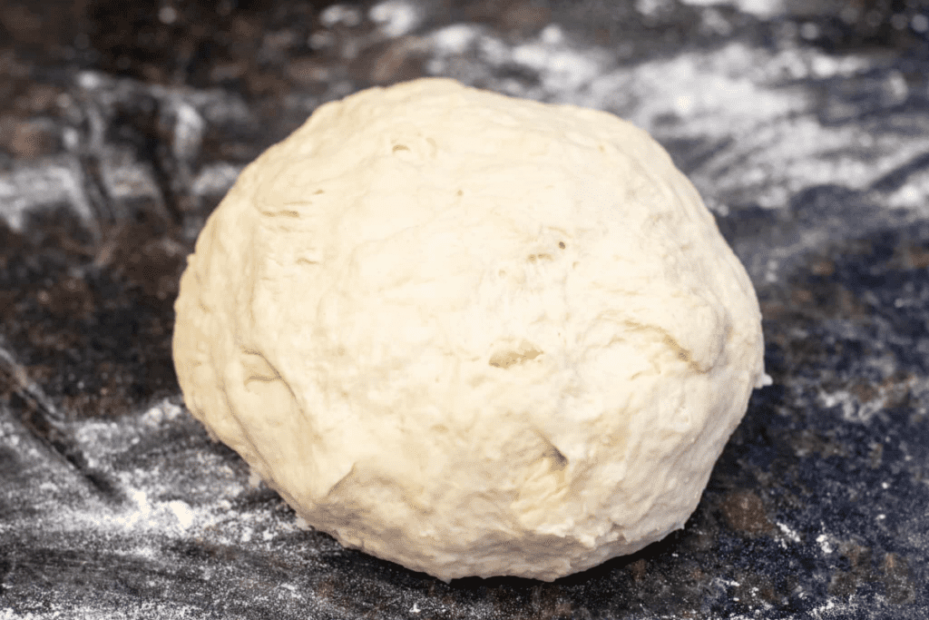 ball of dough on a floured counter.