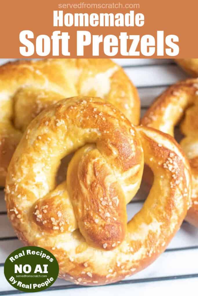 close up of a soft pretzel on a cooling rack with Pinterest pin text and a NO AI sticker.