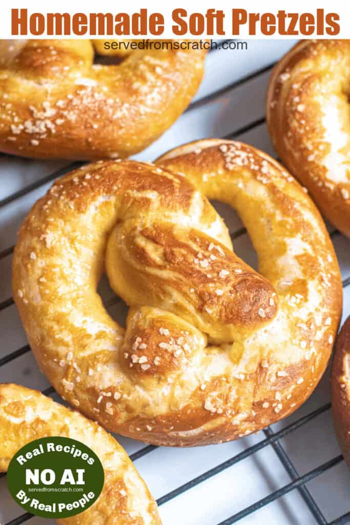 close up of a soft pretzel on a cooling rack with Pinterest pin text and a NO AI sticker.