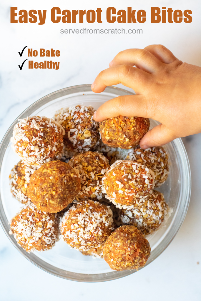 a bowl of oat and carrot balls with coconut with toddler hand grabbing one with Pinterest pin text.