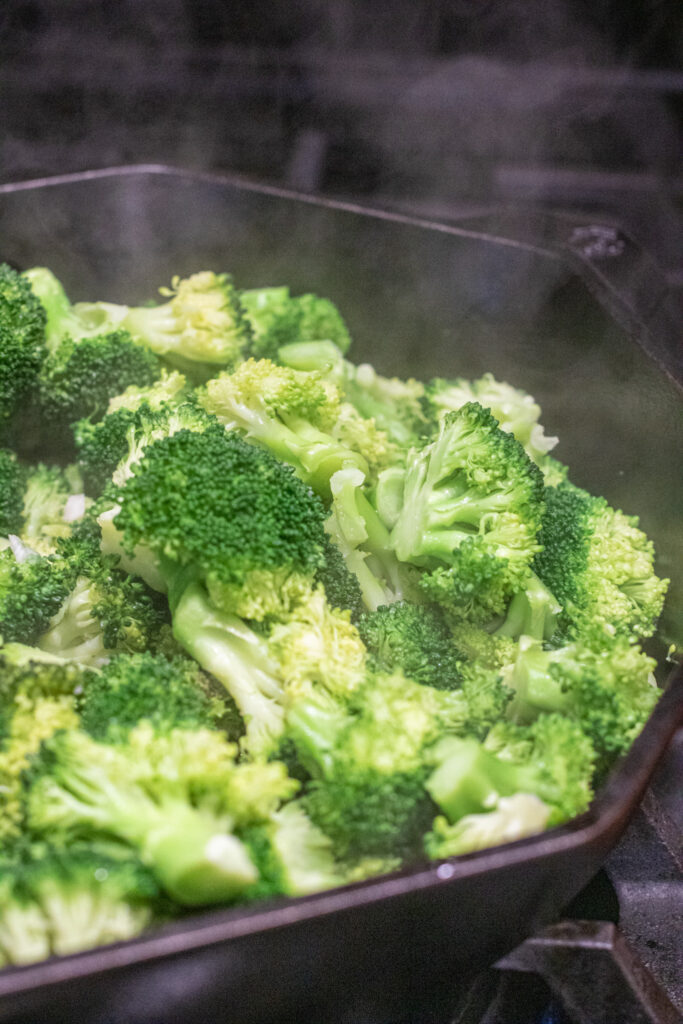 broccoli cooking in a cast iron.  
