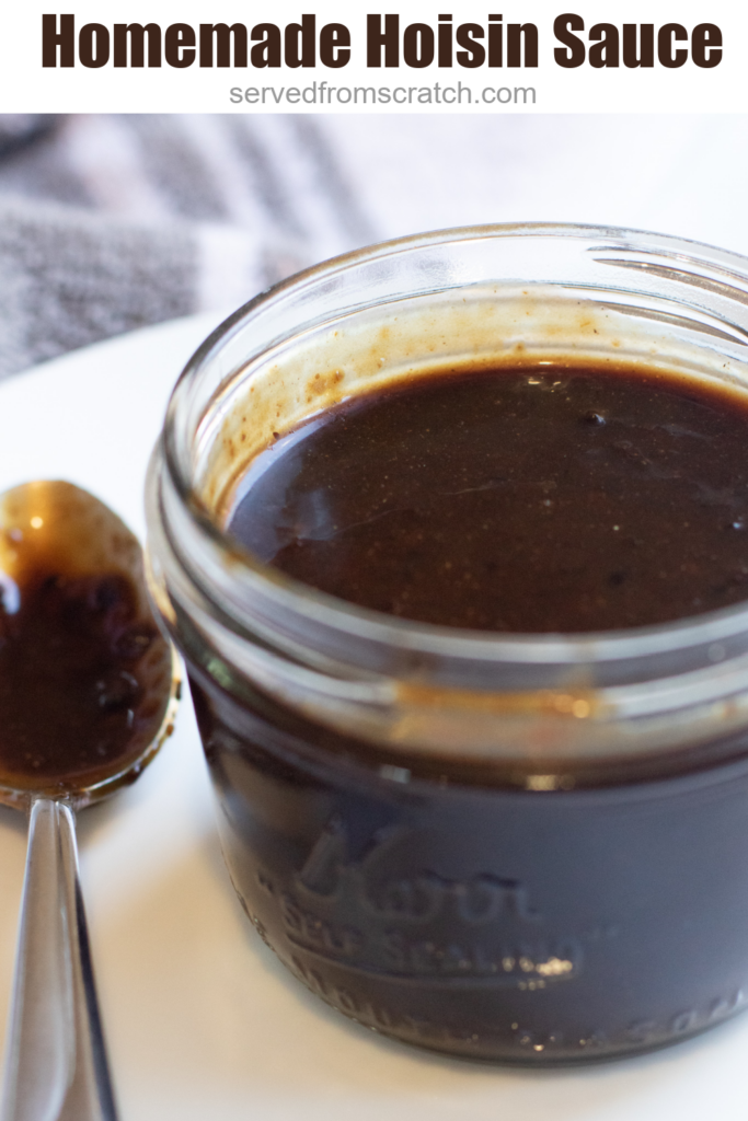 an open small mason jar of hoisin sauce with Pinterest Pin text.