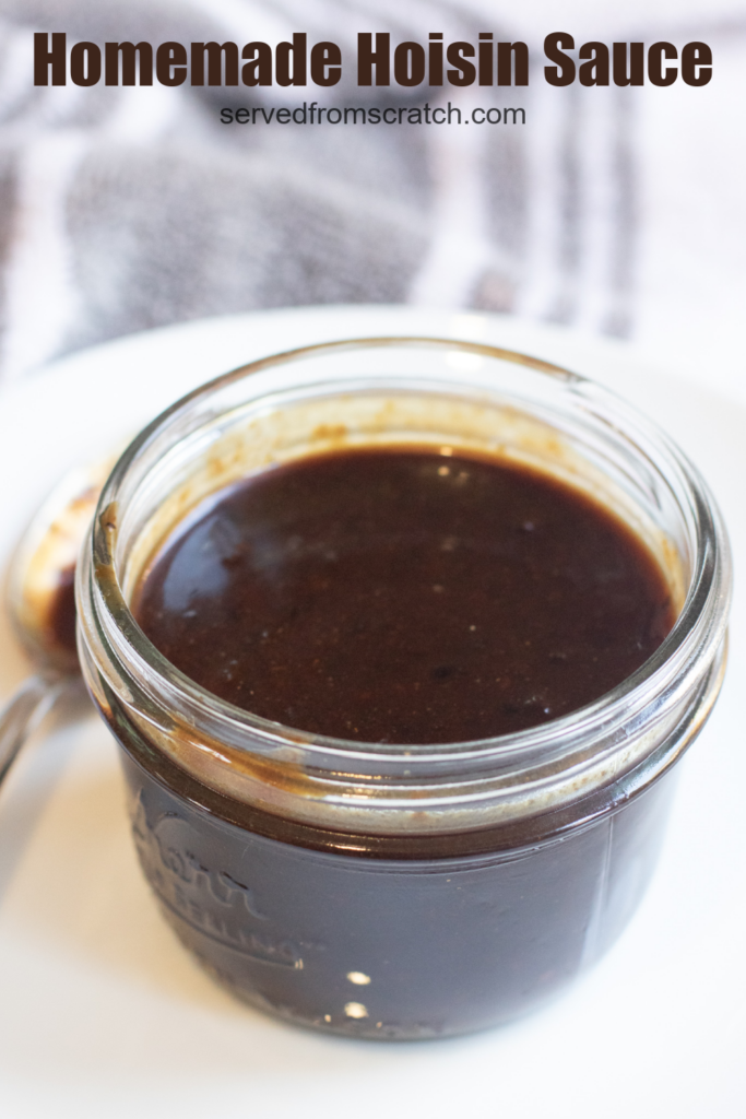 an open small mason jar of hoisin sauce with Pinterest Pin text.