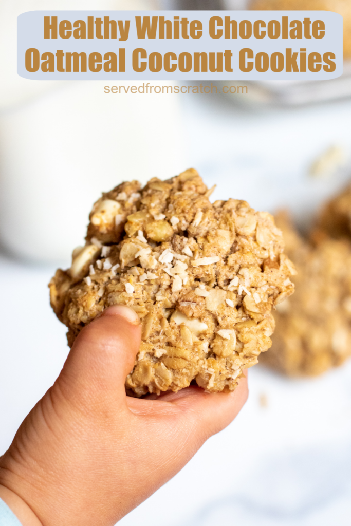 a toddler hand holding a cookie with Pinterest pin text.