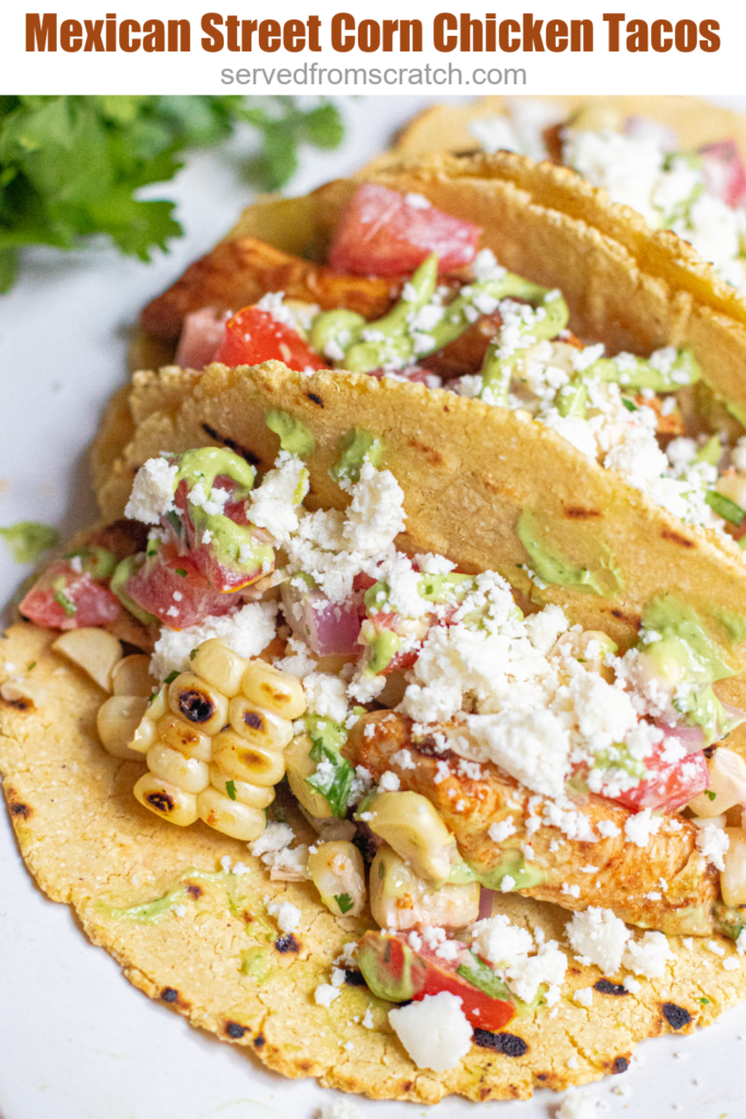 a plate of 3 corn tortilla tacos topped with crumbled cotija cheese and Pinterest pin text.