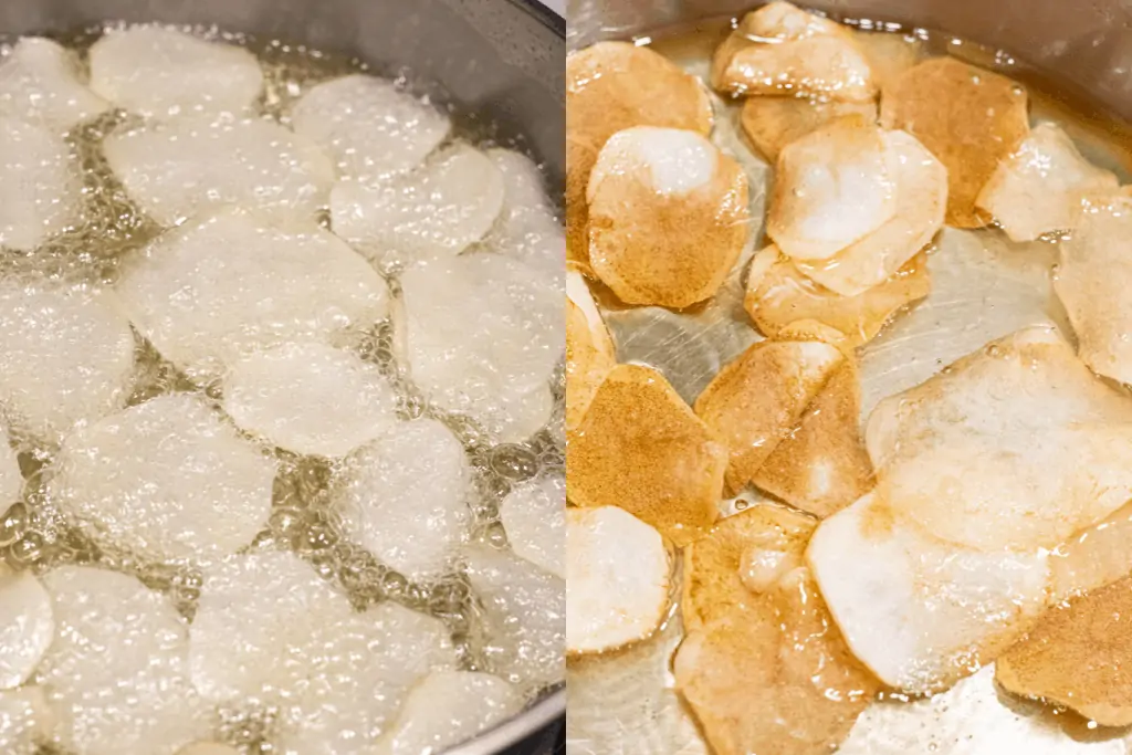 sliced potatoes being fried in oil and then starting to brown in oil.