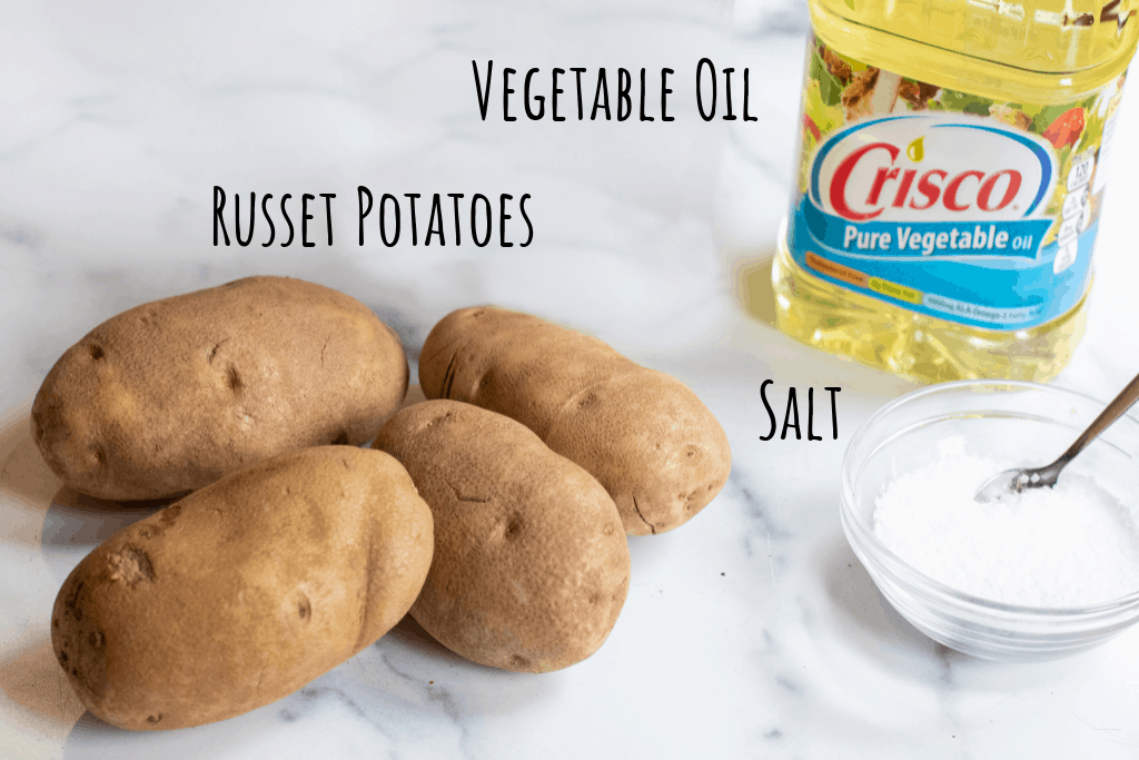 potatoes, vegetable oil, and salt on counter.