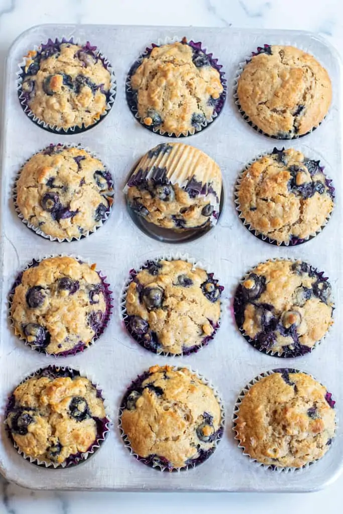 blueberry muffins in a tin.