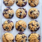 a muffin tin of blueberry muffins.