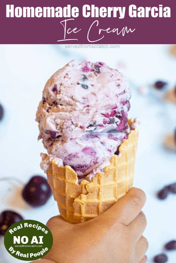 a hand holding an ice cream cone with cherry garcia ice cream and a NO AI sticker.