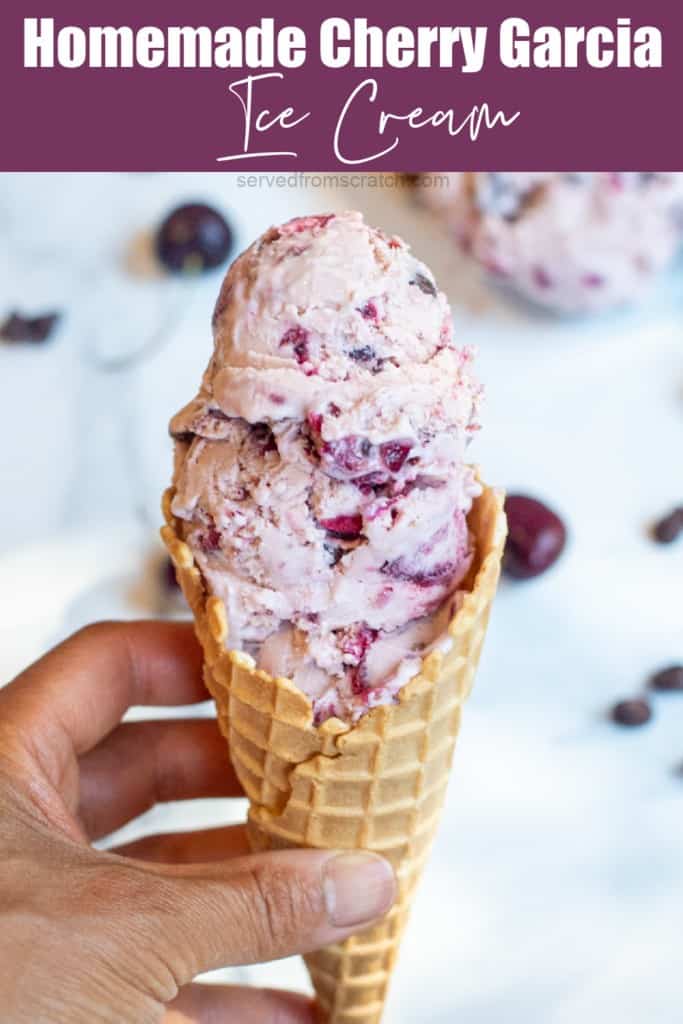 a hand holding an ice cream cone.