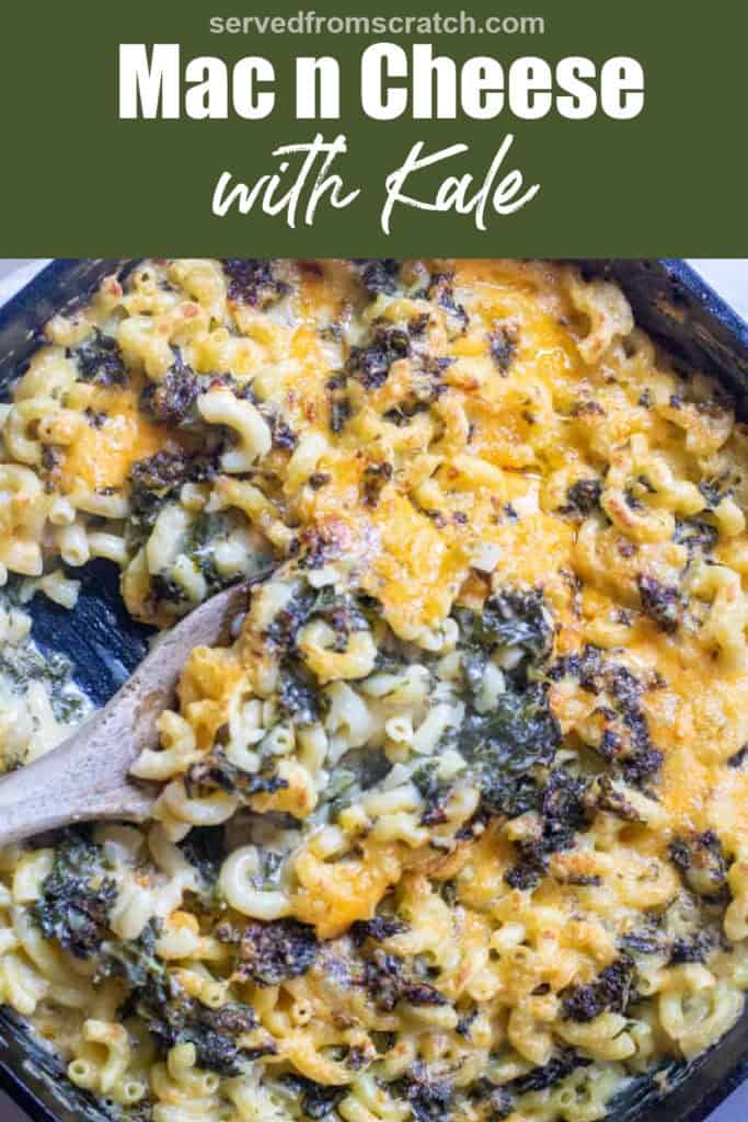 a cast iron skillet with mac n cheese with kale and a wooden spoon with Pinterest pin text.