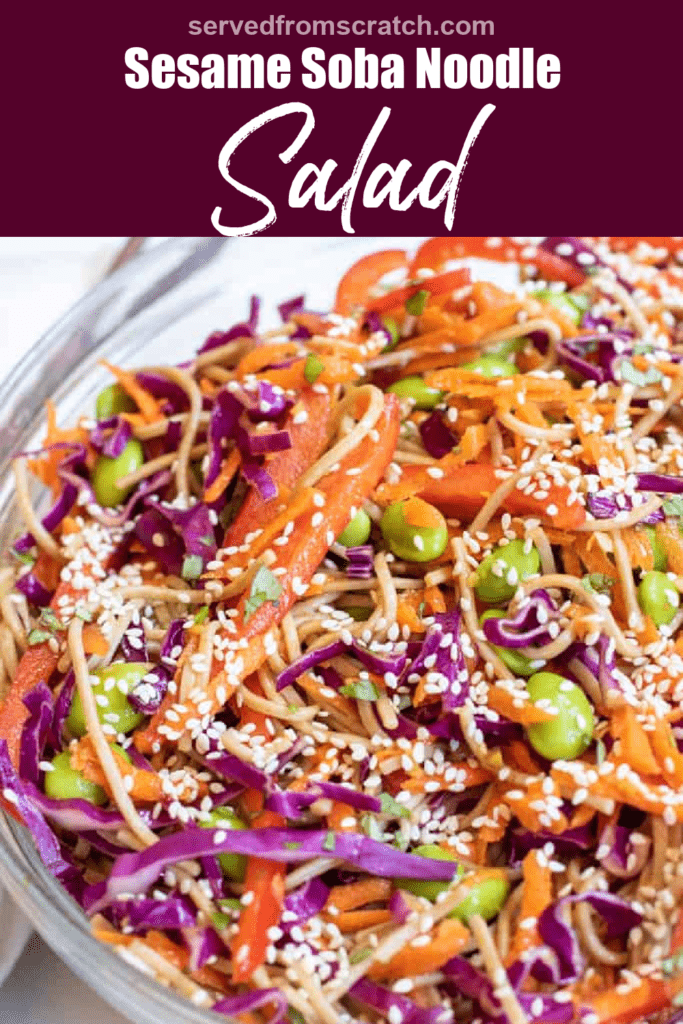 a bowl of soba noodles with cabbage, carrots, edamame, and sesame seeds with Pinterest pin text.