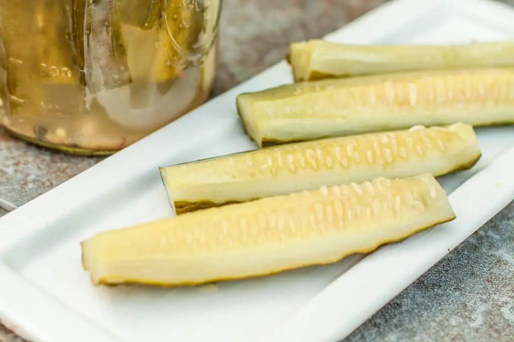 dill pickles on a plate.