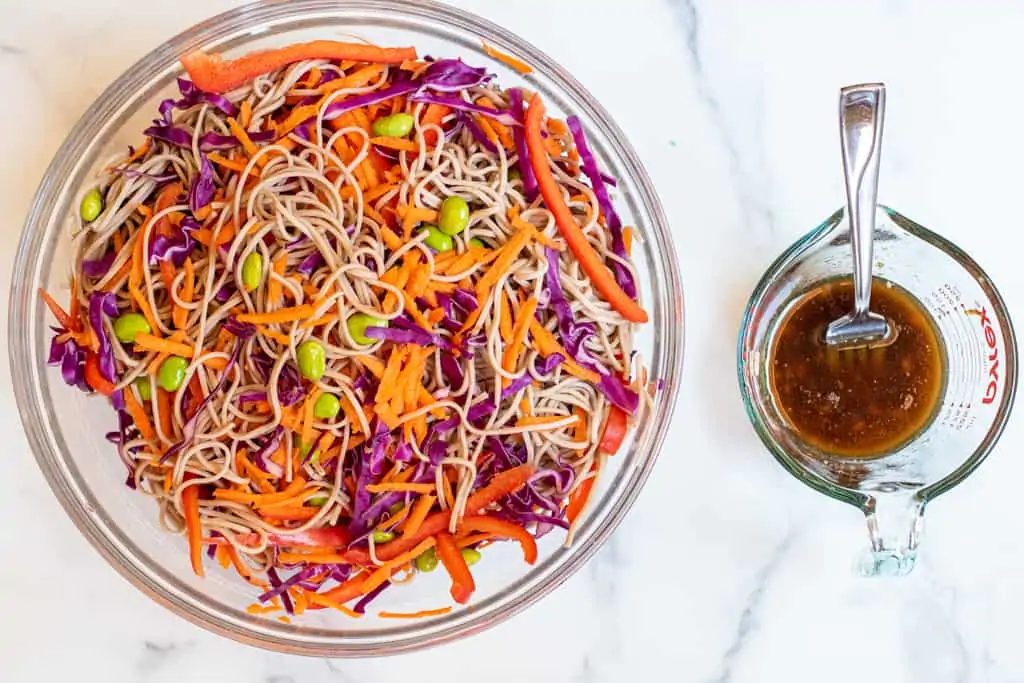 mixed soba noodle salad with dressing in a pyrek.