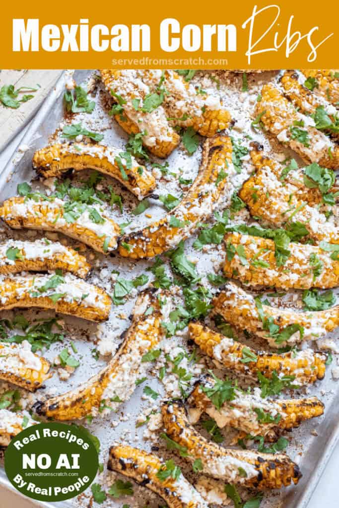an overhead of a tray of corn ribs grilled and covered in cheese with Pinterest pin text and NO AI sticker.