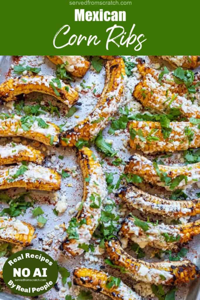 an overhead of a tray of corn ribs grilled and covered in cheese with Pinterest pin text and NO AI sticker.