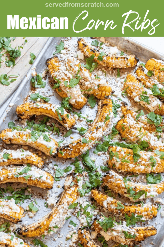 a pan of cooked corn ribs topped with cheese and cilantro with Pinterest pin text.