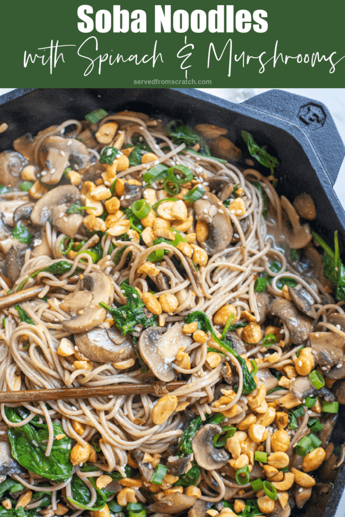 cast iron of noodles with spinach, mushrooms, topped with peanuts and scallions with Pinterest pin text.