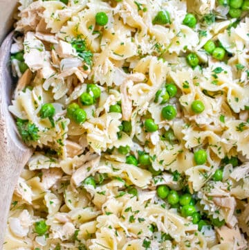 a large pot with farfalle pasta, peas, and tuna.