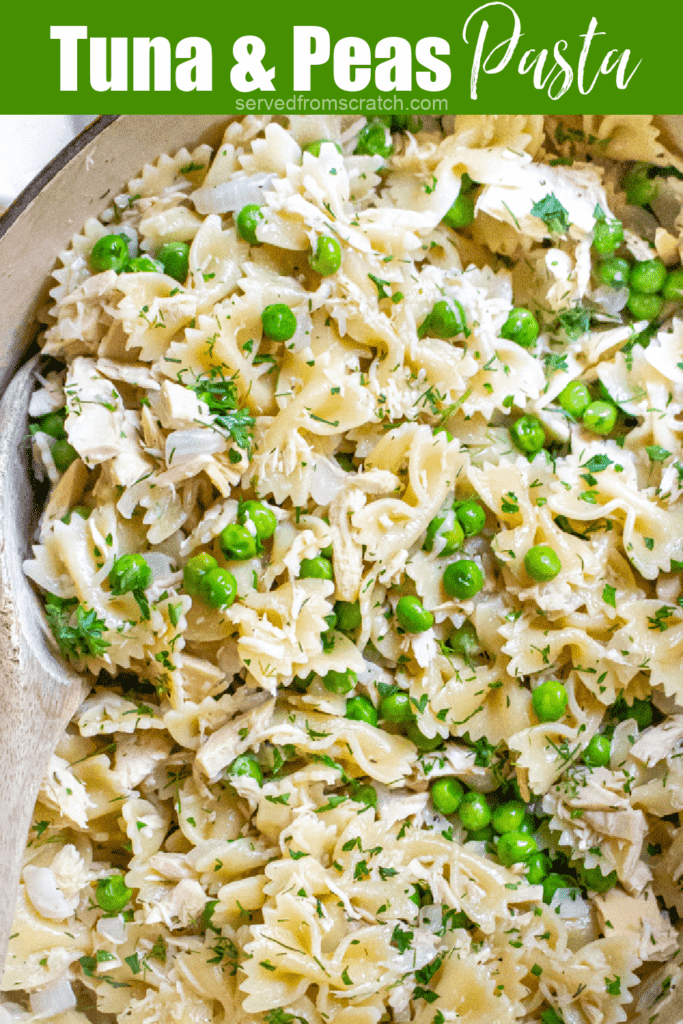 a pot of pasta, peas, and tuna with a wooden spoon and Pinterest pin text.