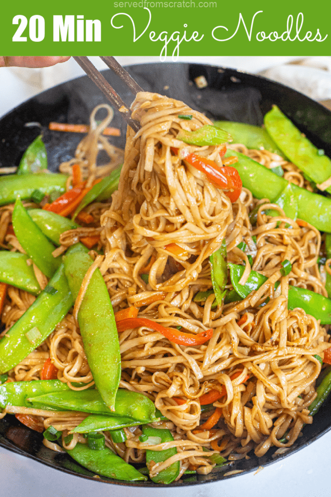 chopsticks holding up noodles from a pan of cooked noodles and veggies with Pinterest pin text.