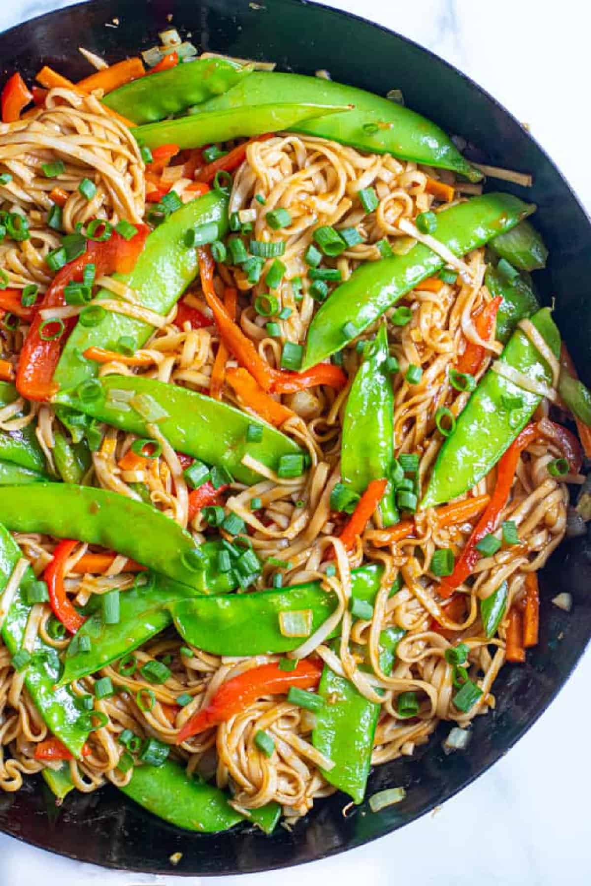 a pan with cooked veggies and noodles.