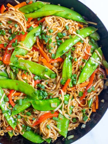 a pan with cooked veggies and noodles.