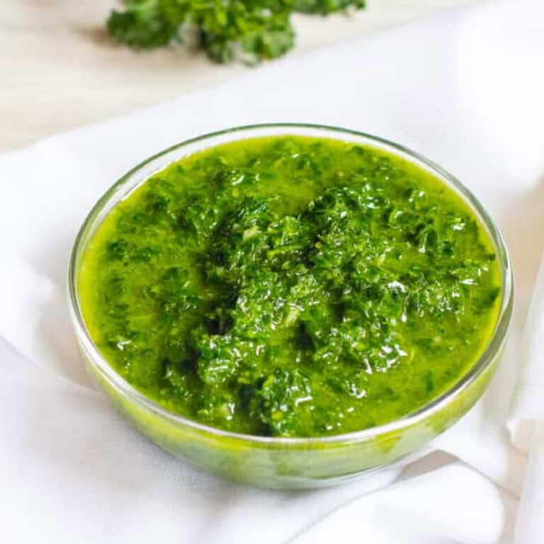 a small bowl of Chimichurri Sauce with Pinterest pin text.