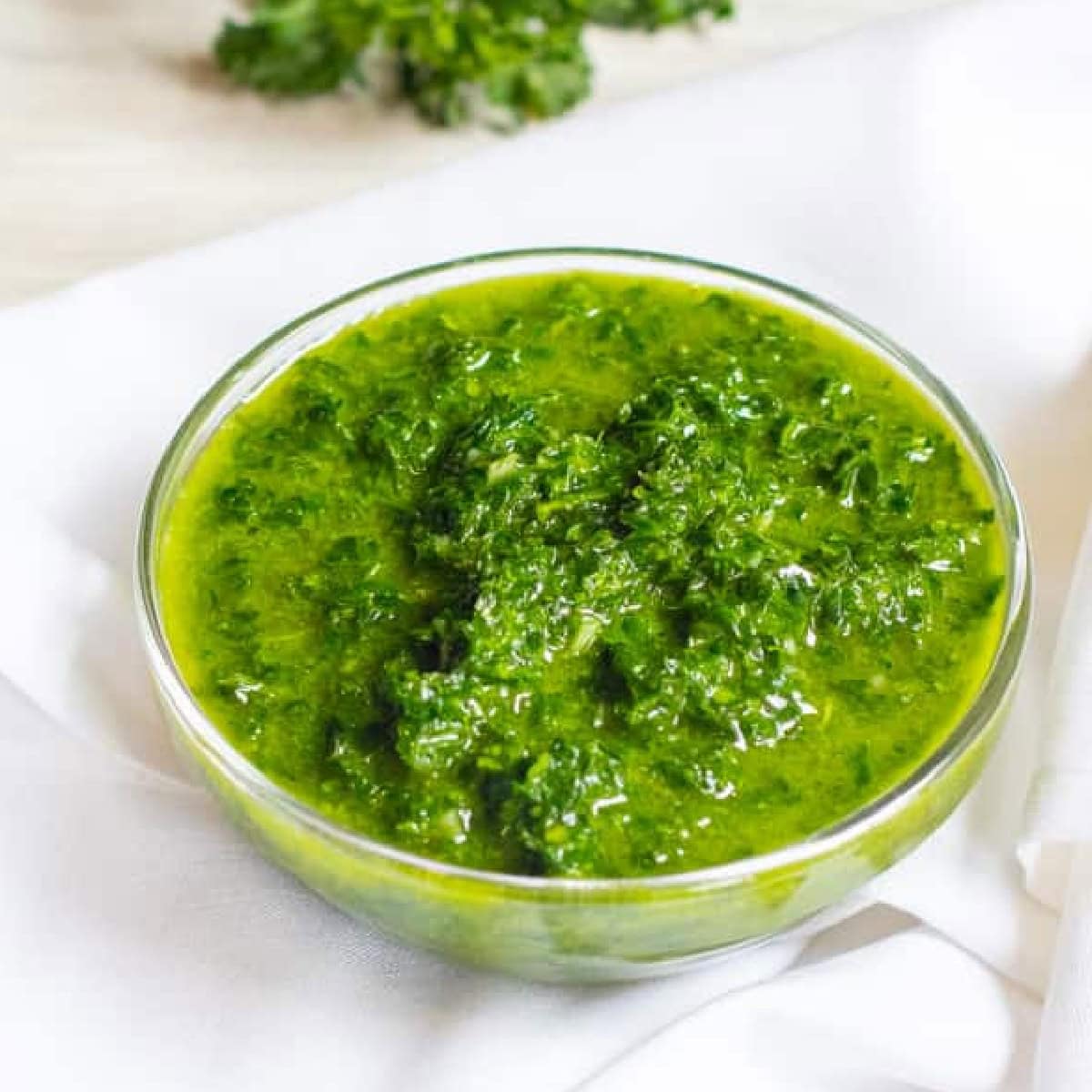 a small bowl of Chimichurri Sauce with Pinterest pin text.