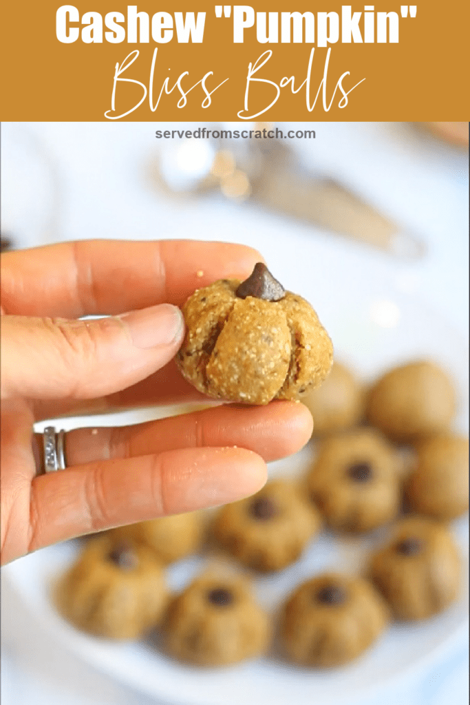 a hand holding a pumpkin shaped bliss ball with Pinterest pin text.