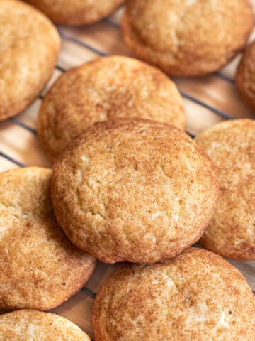 cooling rack of big snickerdoodle cookies.