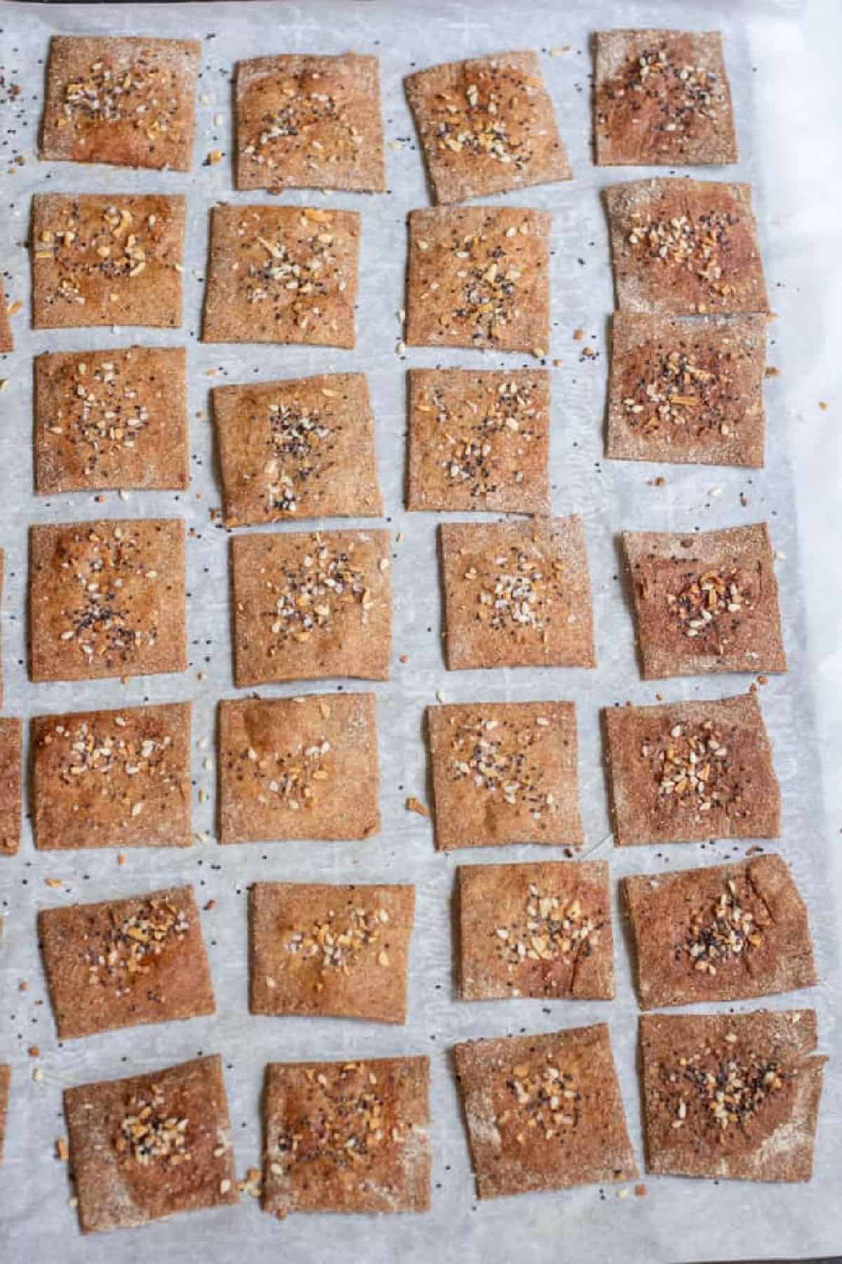 a baking sheet of baked crispy crackers.