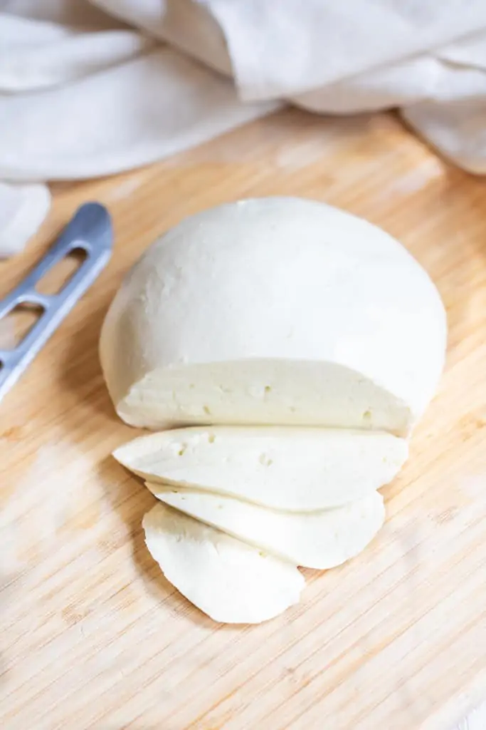 sliced ball of mozzarella cheese.