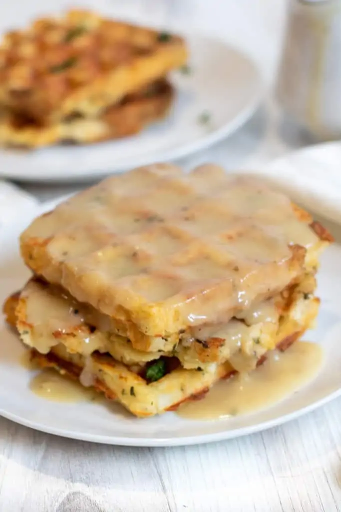 gravy on waffles on a plate.